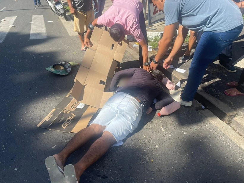 Ciclista caído após impacto