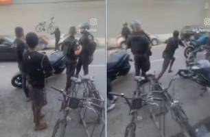 PM joga bicicleta de homem no lixo e tem moto empurrada em confusão no Rio (Foto: Reprodução)
