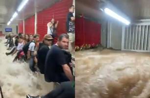 SP: forte chuva alaga estação de metrô e faz passageiros subirem em corrimão (Foto: Reprodução/Internet)
