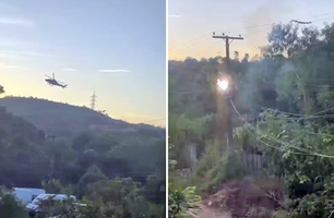 Helicóptero alvo de disparos acaba esbarrando na rede elétrica ao desviar dos tiros (Foto: Reprodução)