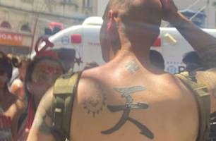 Estrangeiro com símbolo nazista é agredido (Foto: Reprodução) Estrangeiro com símbolo nazista é agredido (Foto: Reprodução)